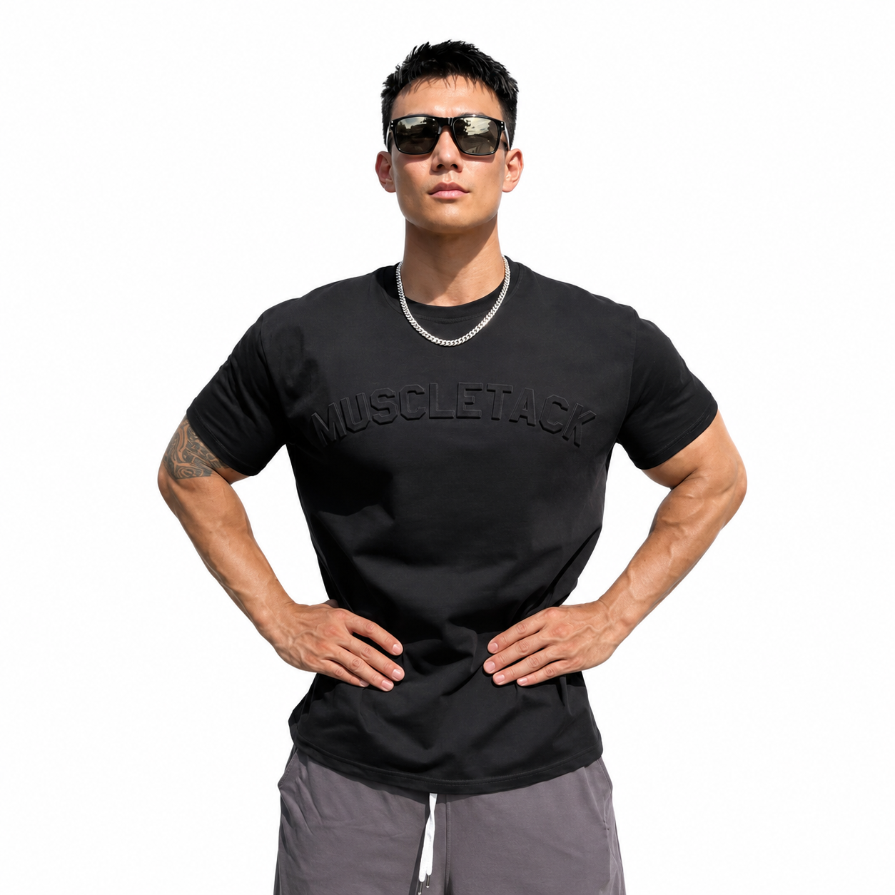 Mens black embossed logo training tee with subtle raised chest logo