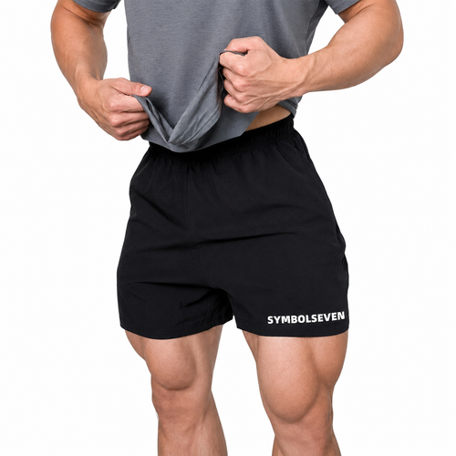 Core Black: Mens black lightweight training shorts with elastic waistband and white hem logo
