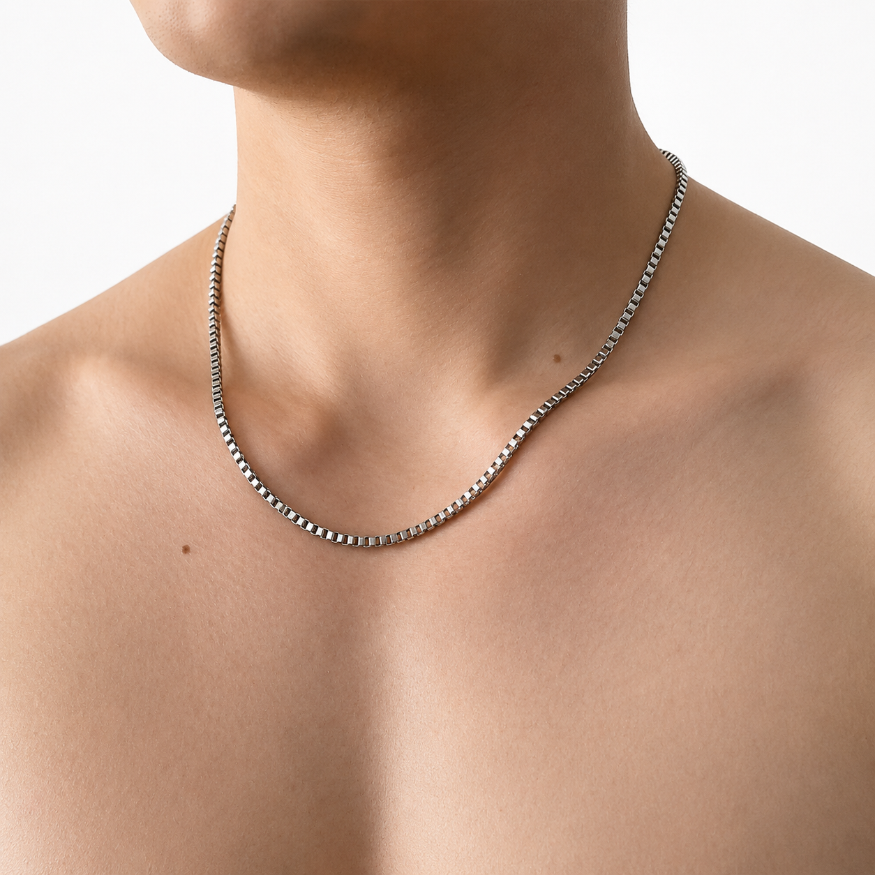 Model Image: Mens silver box chain necklace worn on neckline with a clean minimal look