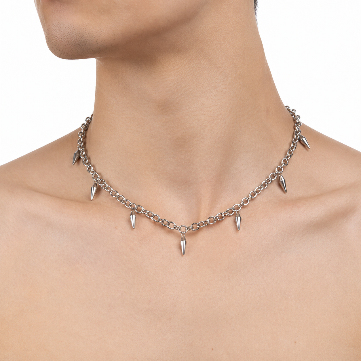 Model Image: Mens silver spike chain necklace worn around the neckline with statement charm details