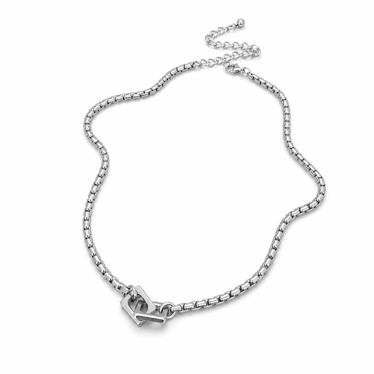 Silver-tone box chain necklace with interlocking double heart pendant on white background