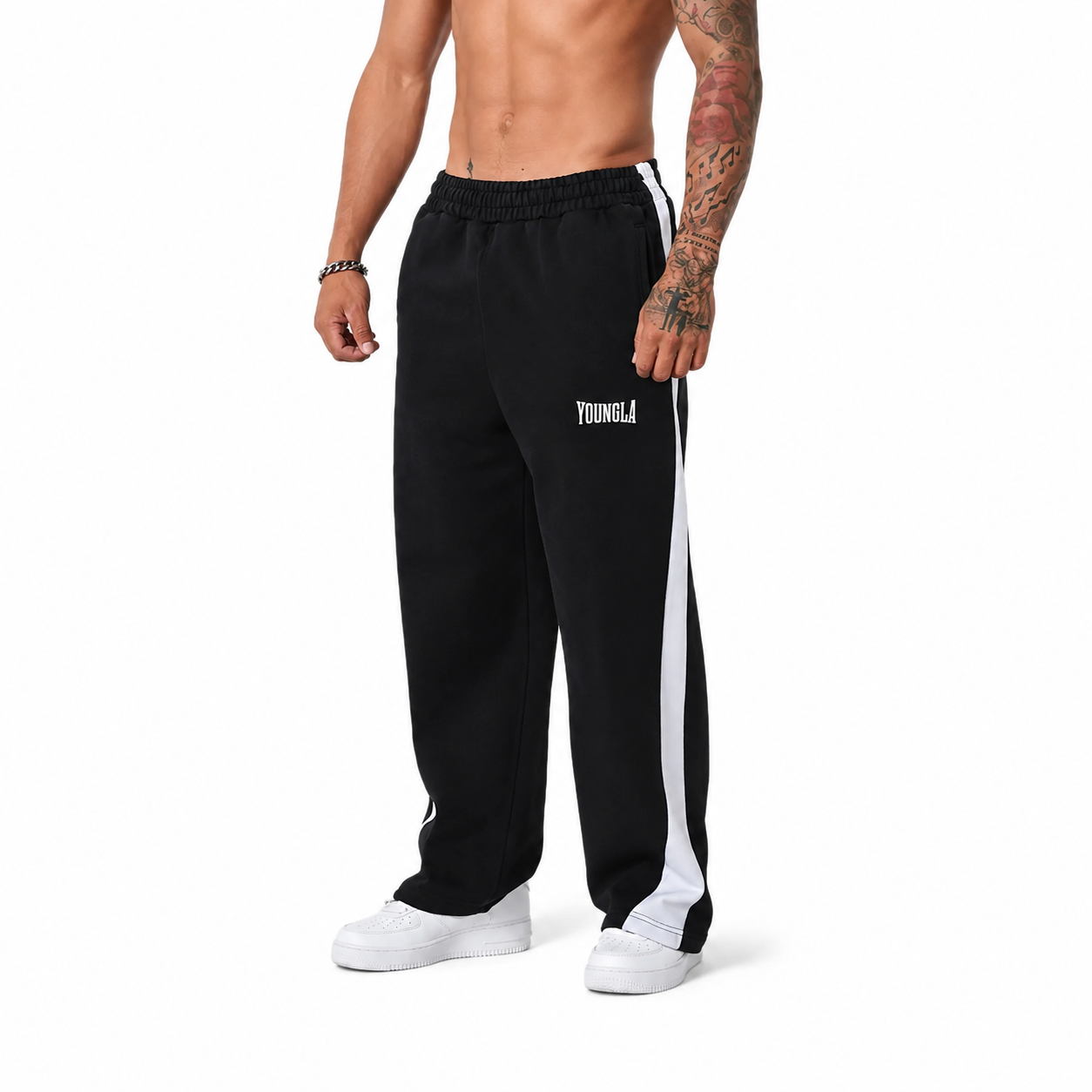 Black men's relaxed training pants with white side stripe and straight-leg fit