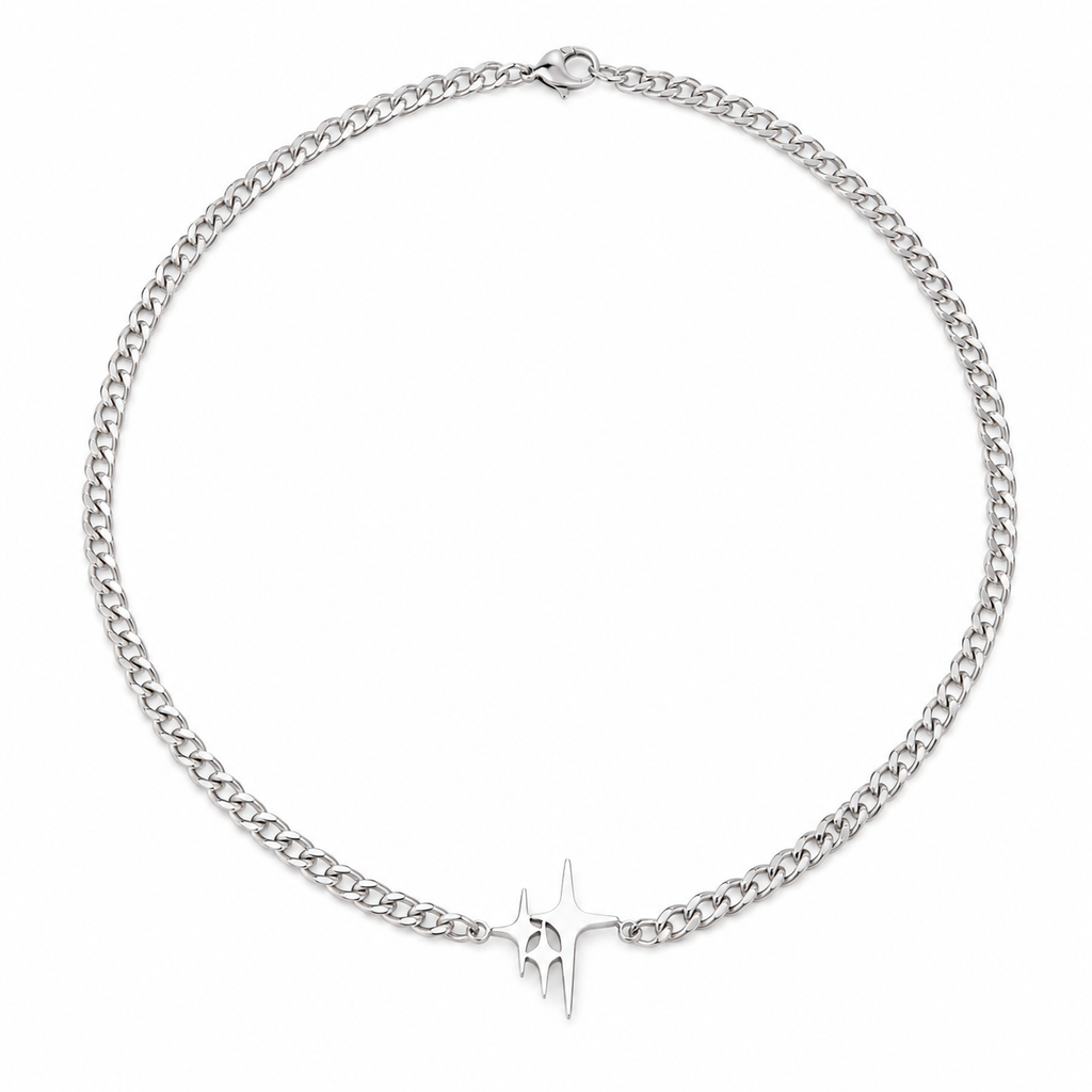 Silver-tone curb chain necklace with abstract spike pendant on white background