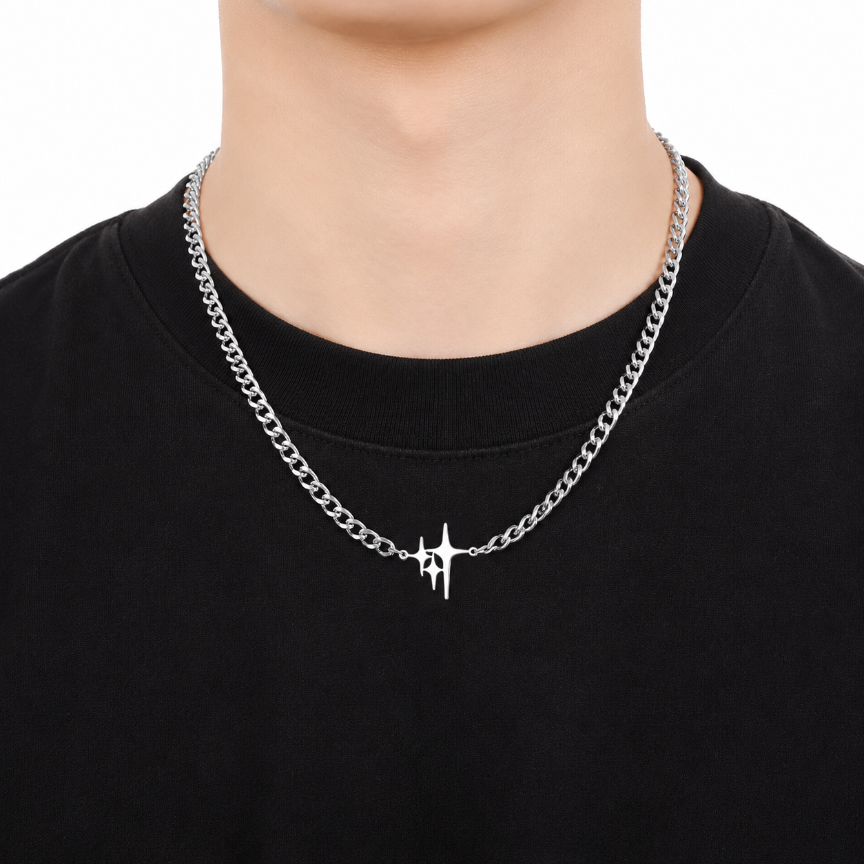 Men's silver spike pendant necklace worn with black crew neck shirt