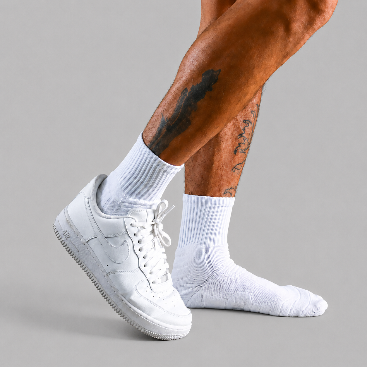 White men's crew socks styled with white sneakers for training and daily wear