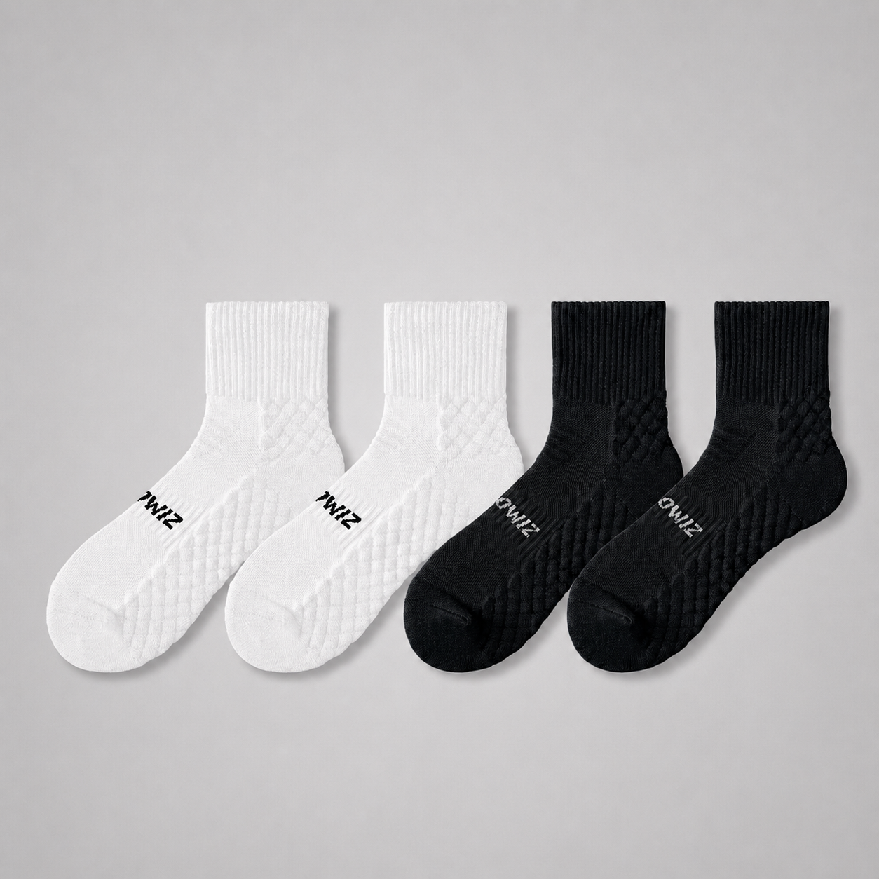 White and black men's cushioned quarter crew training socks with ribbed cuffs