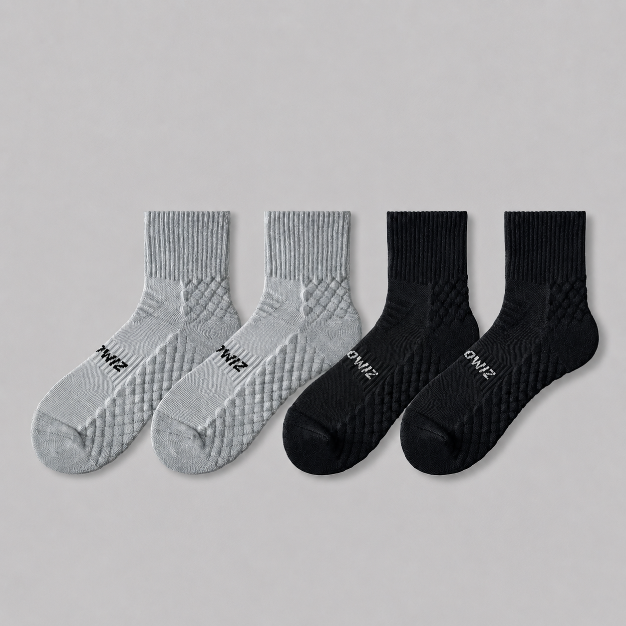 Grey and black men's athletic quarter crew socks with textured support zones