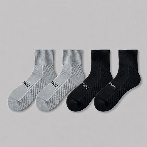 Grey and black men's athletic quarter crew socks with textured support zones