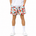 Varenform tropical print men’s training shorts worn with white T-shirt and slides