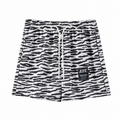Men's zebra print athletic shorts flat front view with elastic waistband and white drawcord.