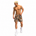 Varenform safari animal print training shorts styled shirtless with white sneakers