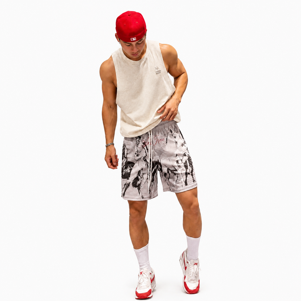 Men's grey horse print mesh athletic shorts worn with a sleeveless top and sneakers.