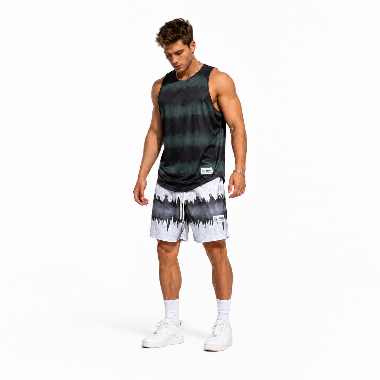 Varenform dark teal black cloud dye sleeveless tank styled with printed training shorts