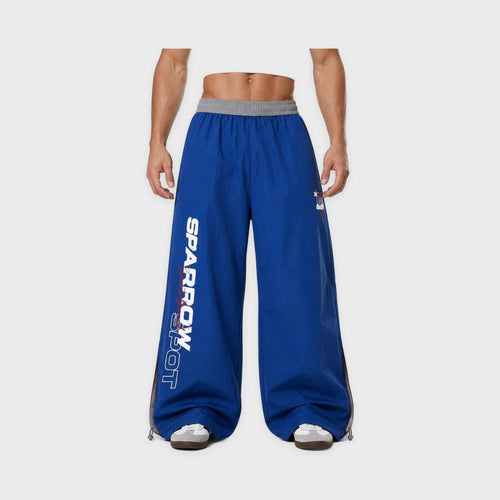 Men's Blue Lettered Wide-Leg Sweatpants in Blue – model-worn front view