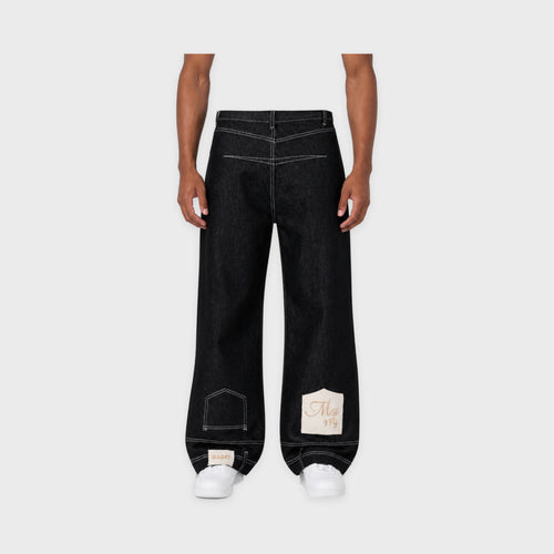 Men's Black Reverse-Seam Barrel Jeans in Black – model-worn front view