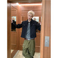 Men's Washed Denim Utility Jacket in black - worn view