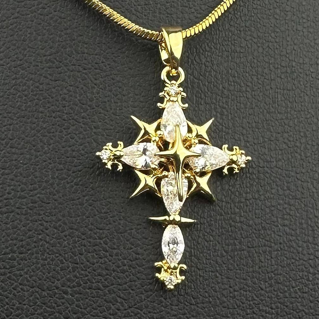 Gold-tone cross pendant necklace shown from another angle