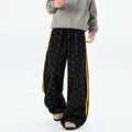 Men's Star-Print Side-Stripe Wide-Leg Sweatpants in black - worn view