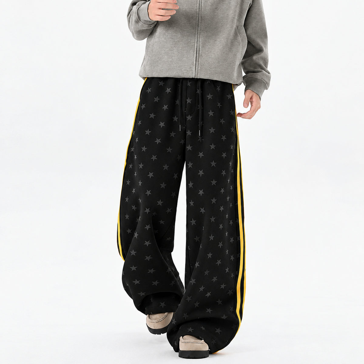Men's Star-Print Side-Stripe Wide-Leg Sweatpants in black - worn view