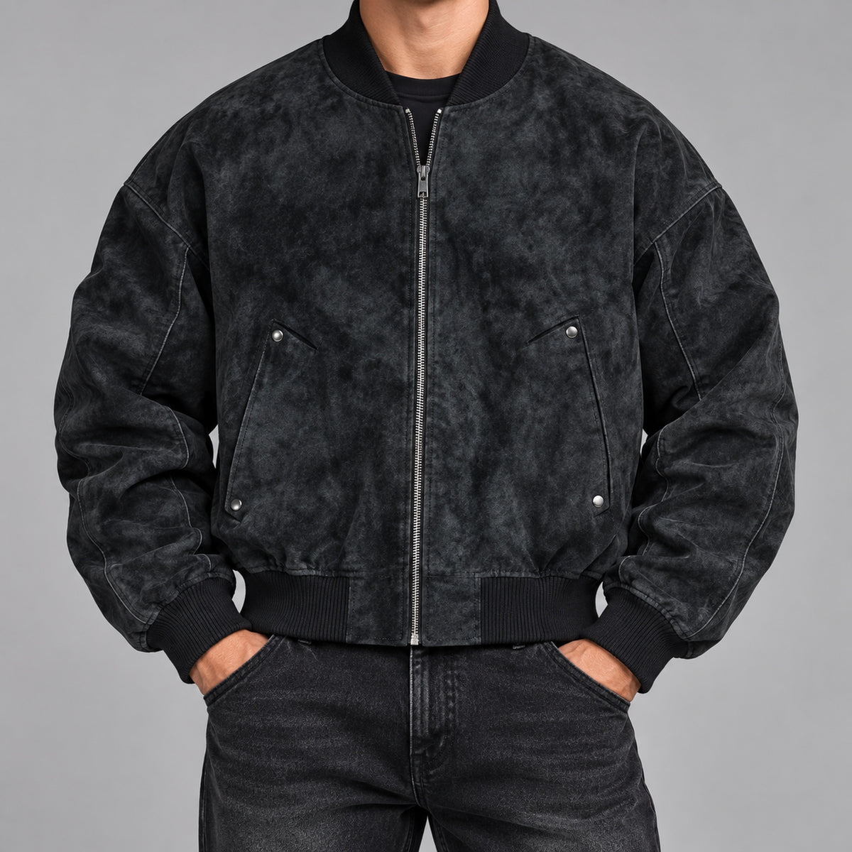 Men's washed faux-suede bomber jacket in black - worn view