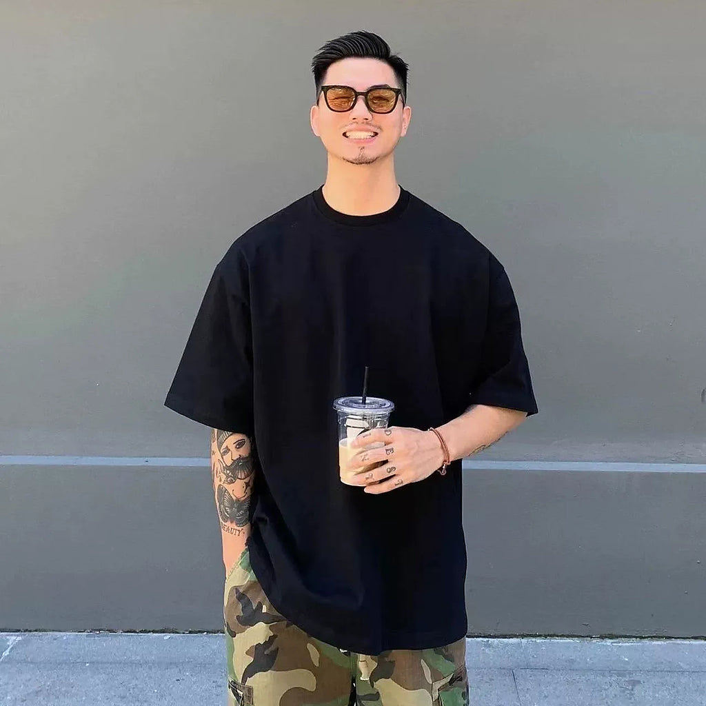 Men's black 320 GSM heavyweight cotton short-sleeve crewneck T-shirt worn as a base layer