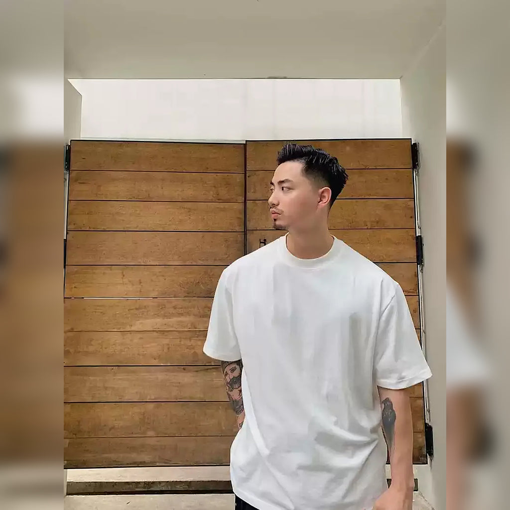 Men's white 320 GSM cotton short-sleeve T-shirt shown in a relaxed everyday outfit