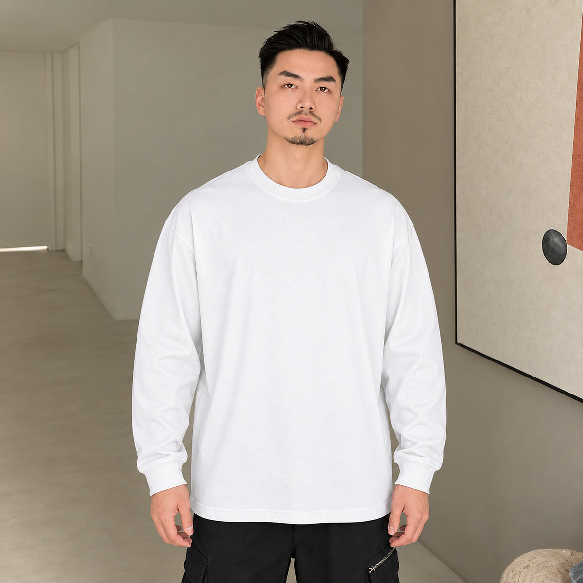 Men's white 400 GSM heavyweight cotton long-sleeve crewneck T-shirt, front outfit view